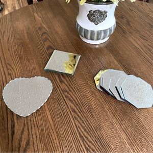 Various sizes of mirrored candle holders